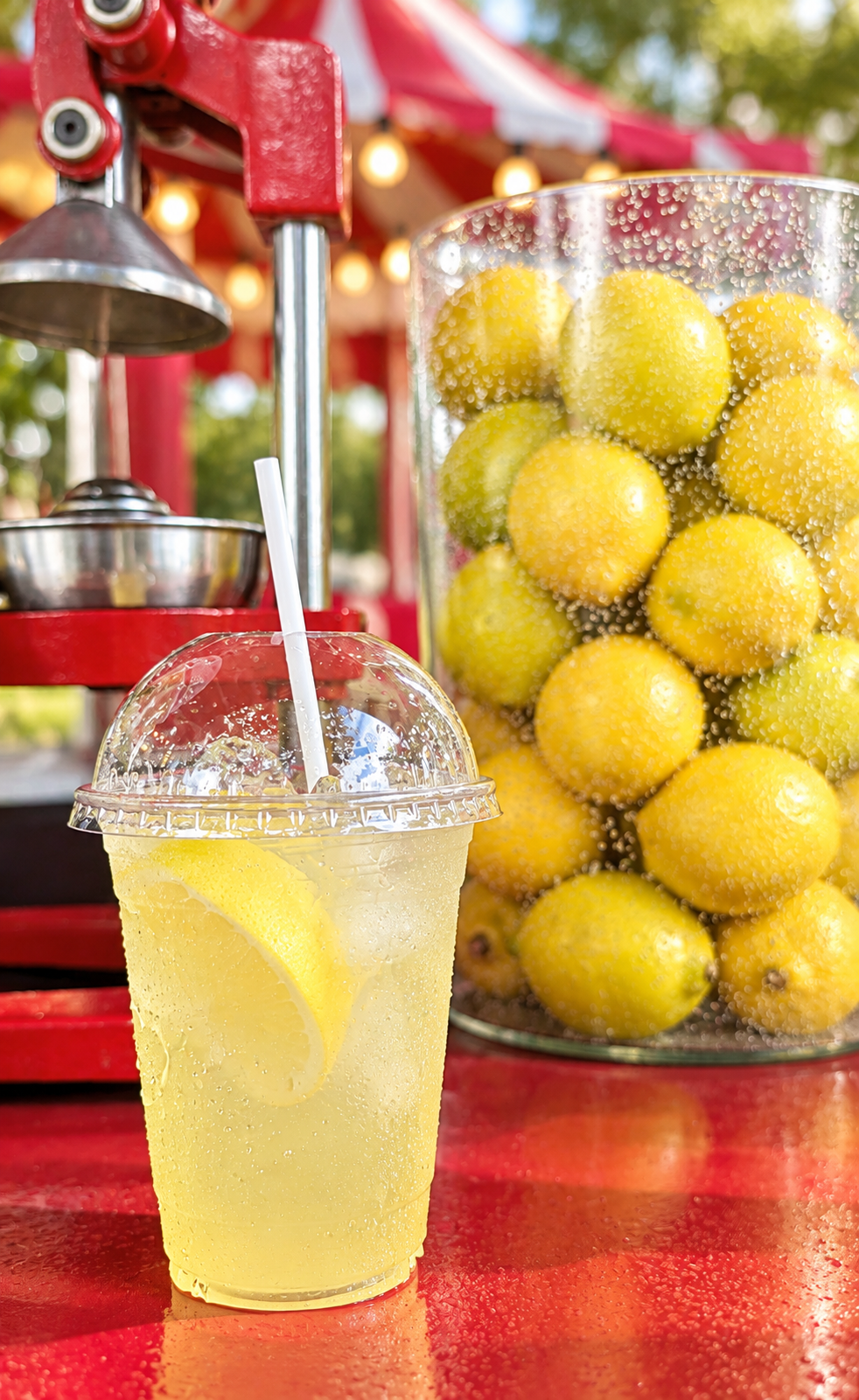 Fresh-squeezed lemonade with lemons and citrus press