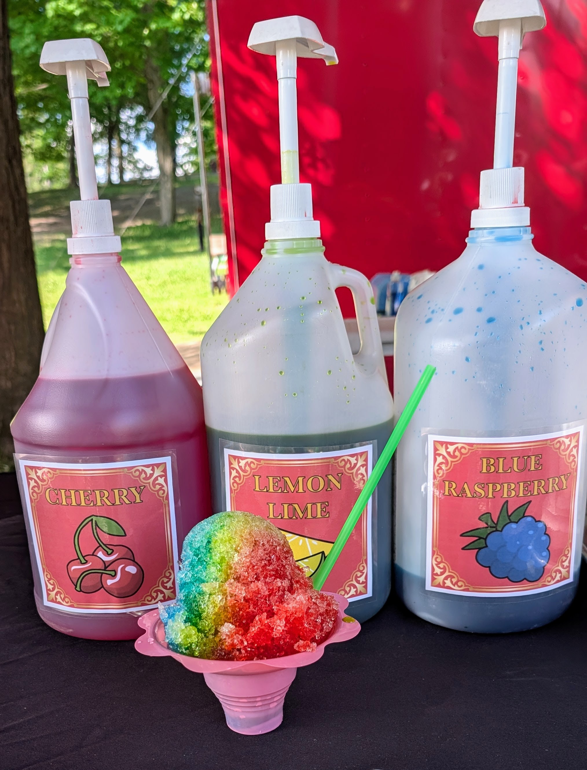 Colourful Sno-Kone with cherry, lemon lime, and blue raspberry flavours